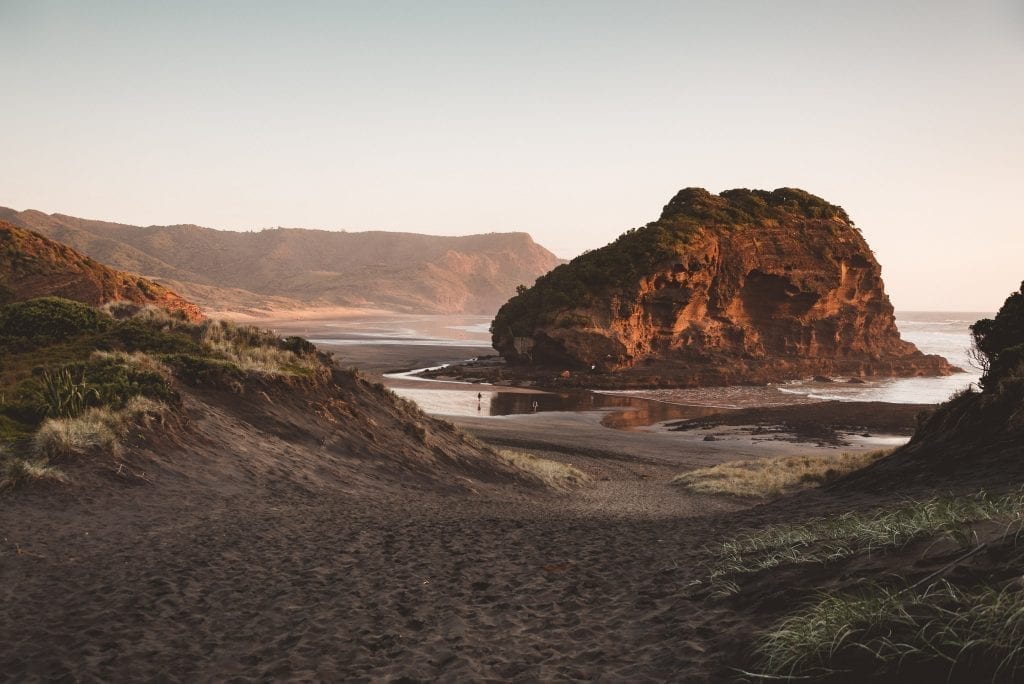 bethells beach te henga at sunset