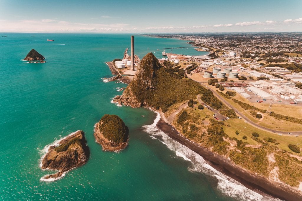 an aerial photo of the sugar loaf islands and back beach in new plymouth